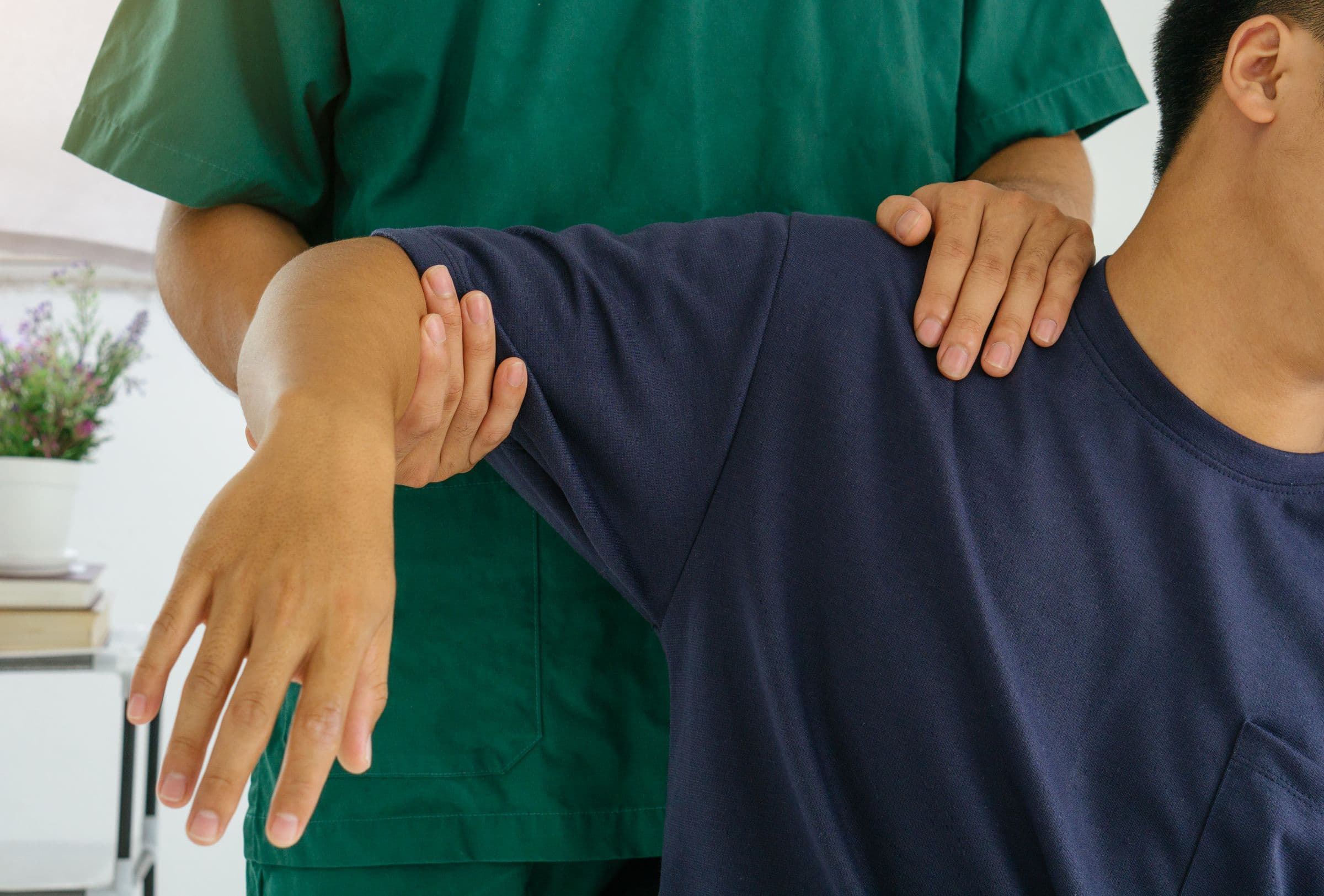 Chiropractor performing stretching treatment on a patient