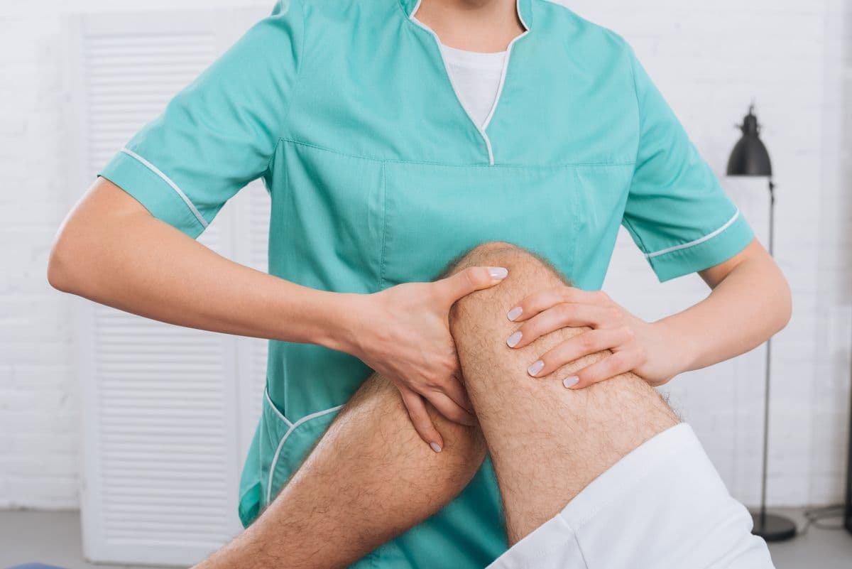 Massage therapist providing personalized leg therapy